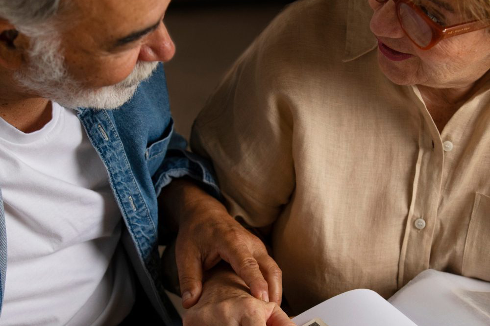 seniors-sitting-table-together-smiling-happily-retirement-home