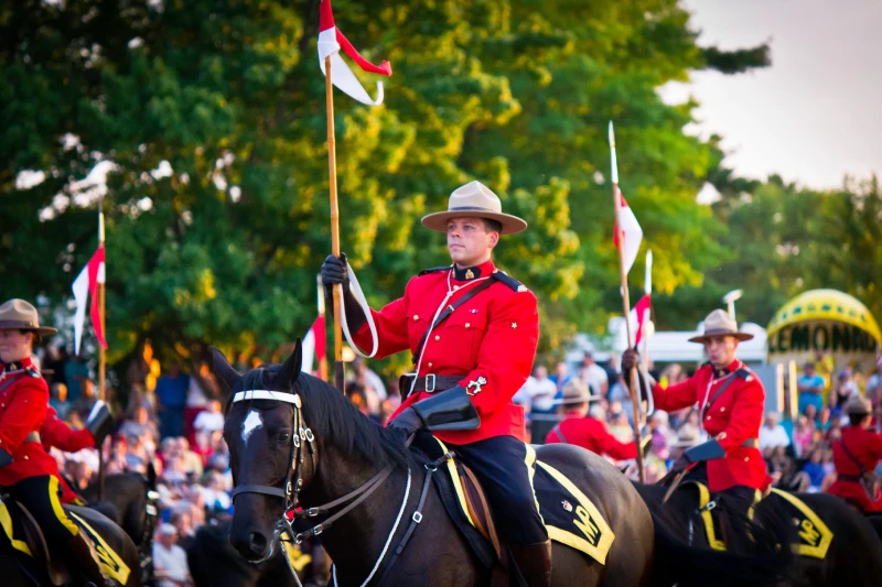 OTTAWA, CANADA - JUNE 27, 2013 The Royal Canadian Mounted Police RCMP Musical Ride performs during its Sunset Ceremonies series in Ottawa, Canada on June 27, 2013